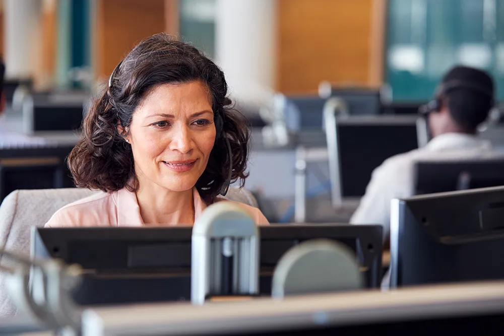 woman sitting in front of desktop