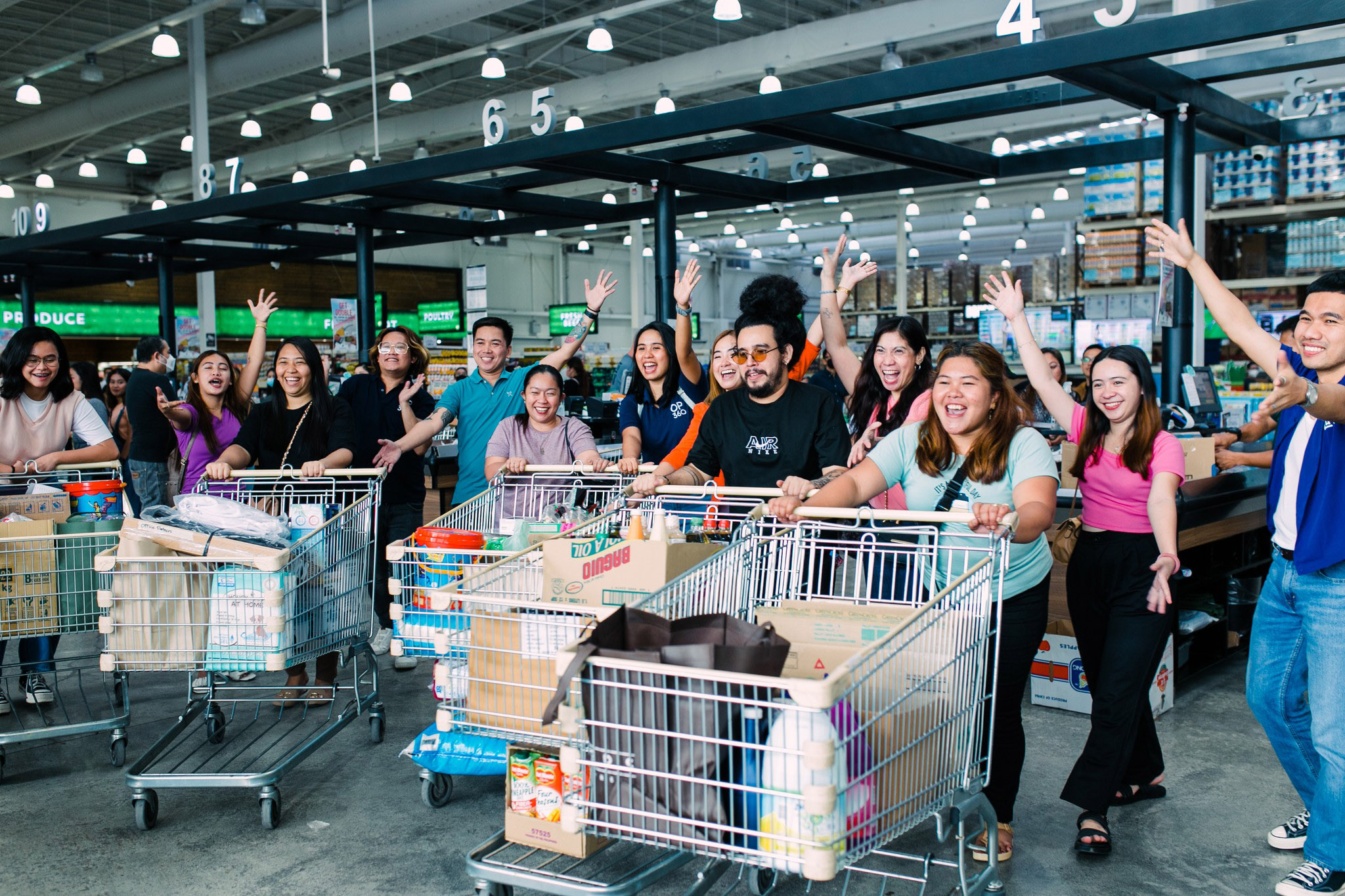 Group photo of people with shopping carts